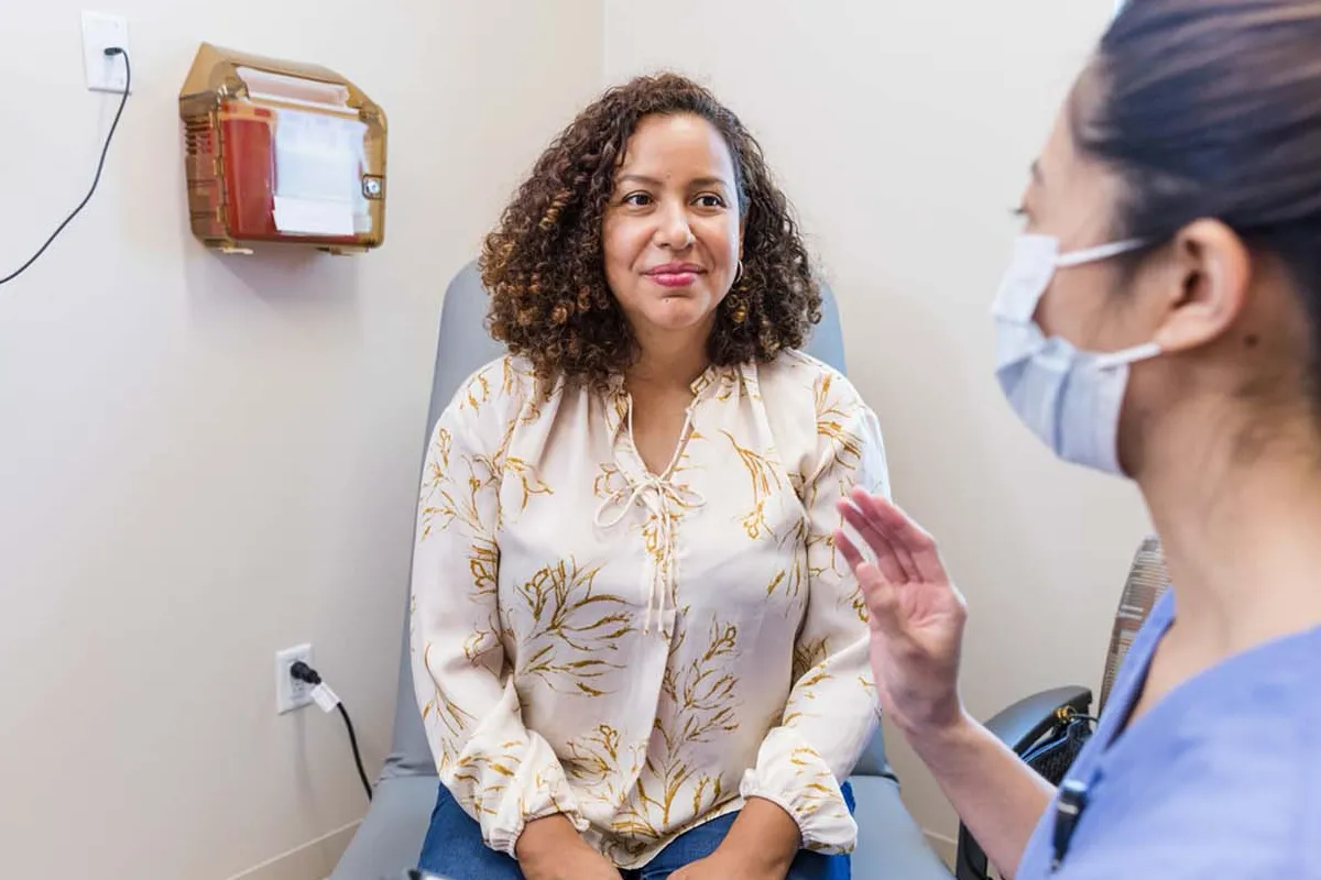 A patient talking with a nurse