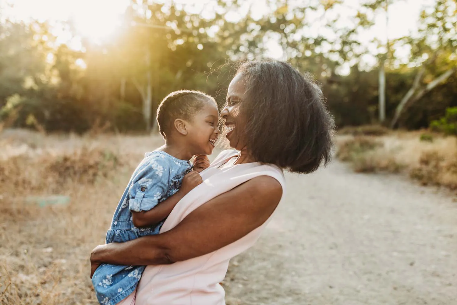 A woman holding a young child